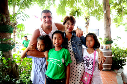 Children living with HIV/AIDS from The Camillian Social Center Rayong having a special lunch with the Italian captains.